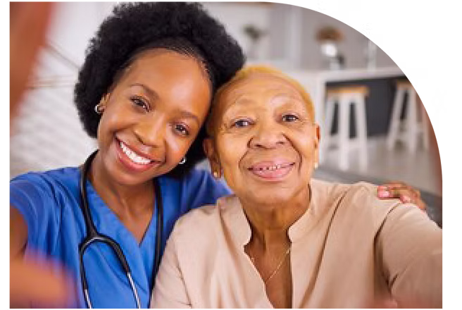 A home health professional smiling with an older adult